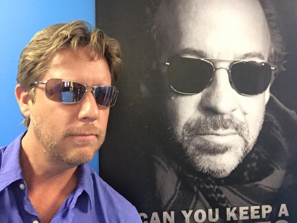Chad holding an Emmy award — a milestone in continuous growth