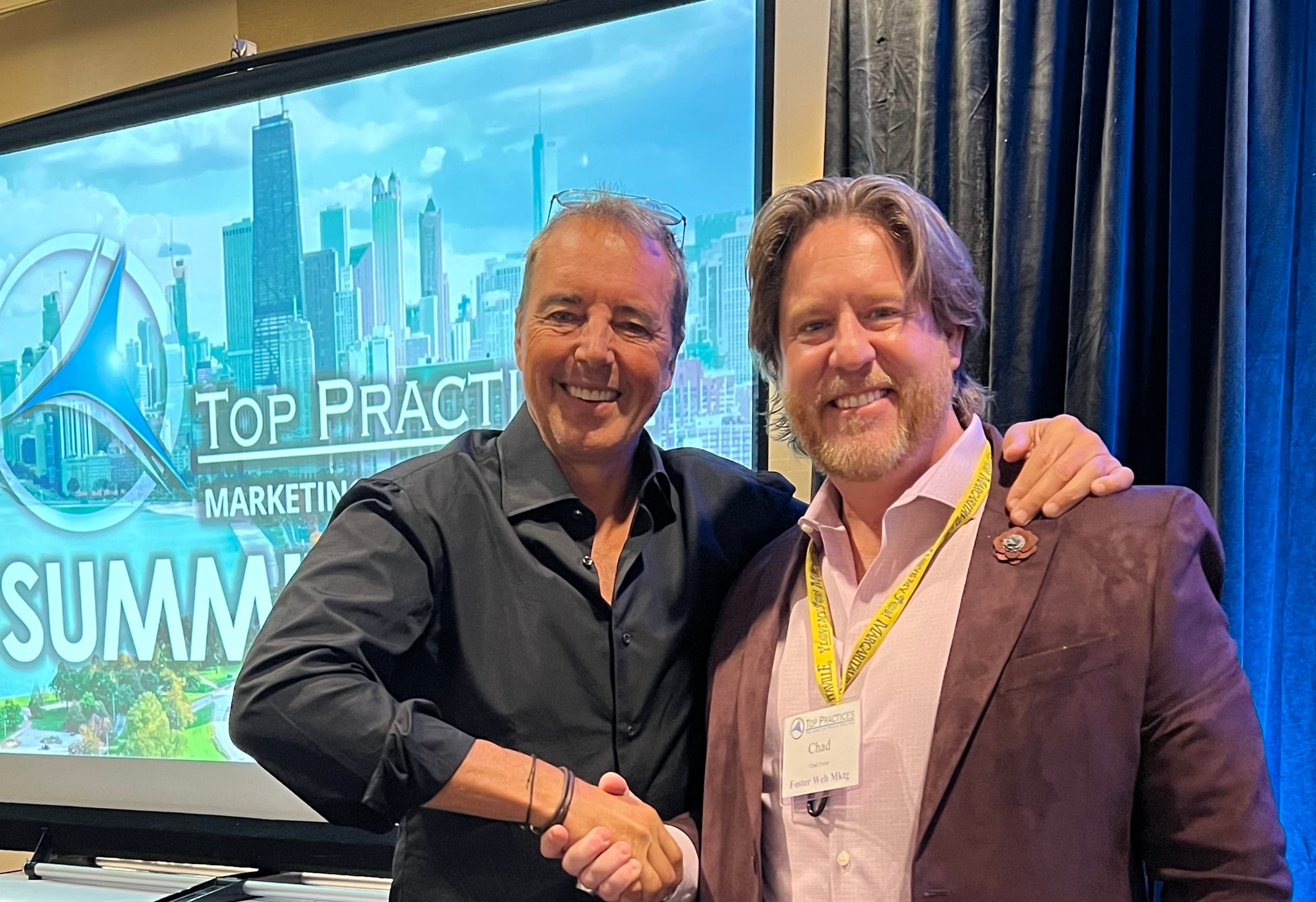 Chad Foster with Dan Buettner at Top Practices Marketing Summit