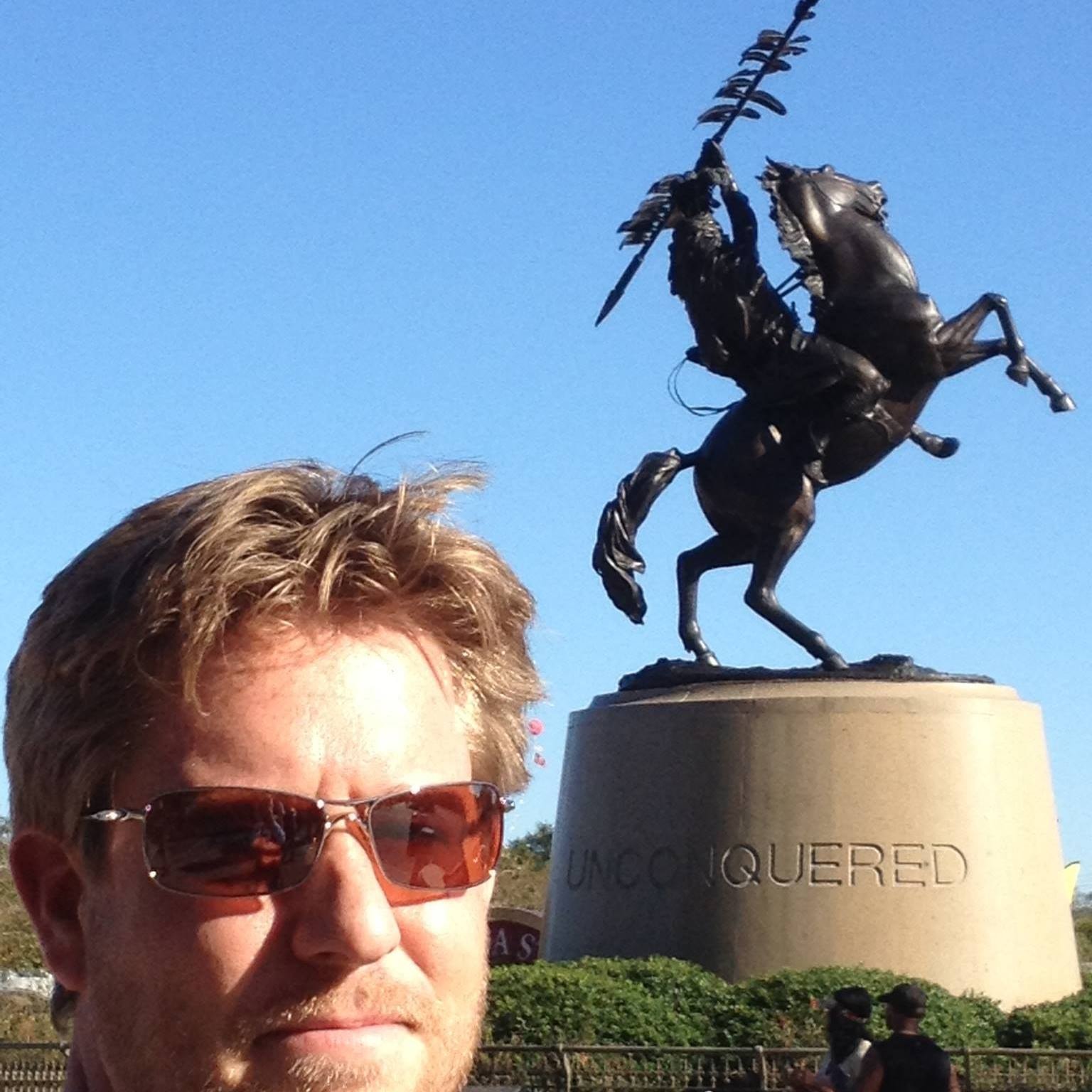 Chad Foster at the Unconquered statue