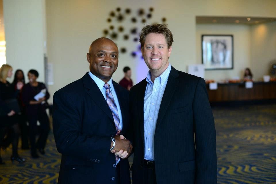 Chad connecting with a colleague at a business event